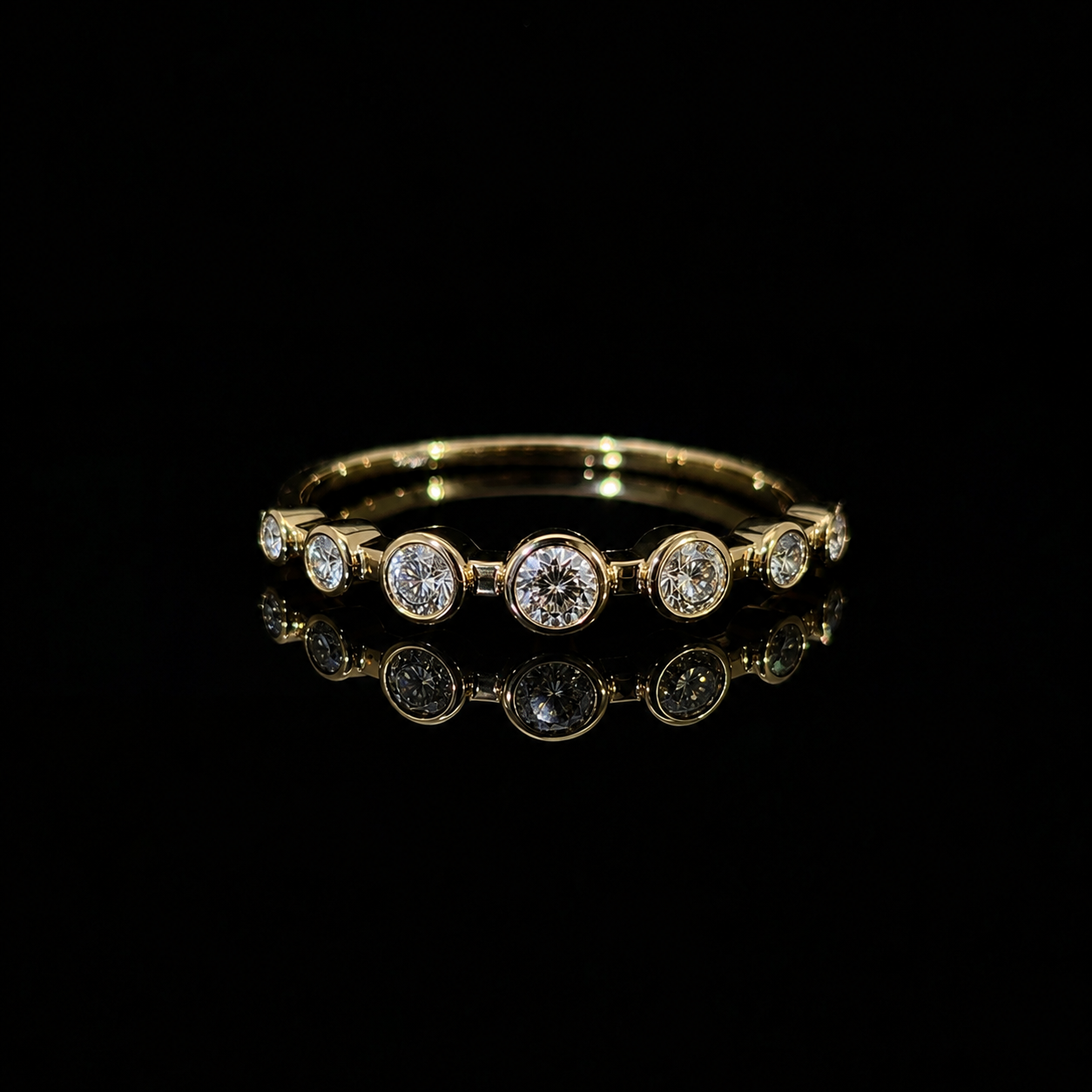 Graduated Bezel Diamond Ring